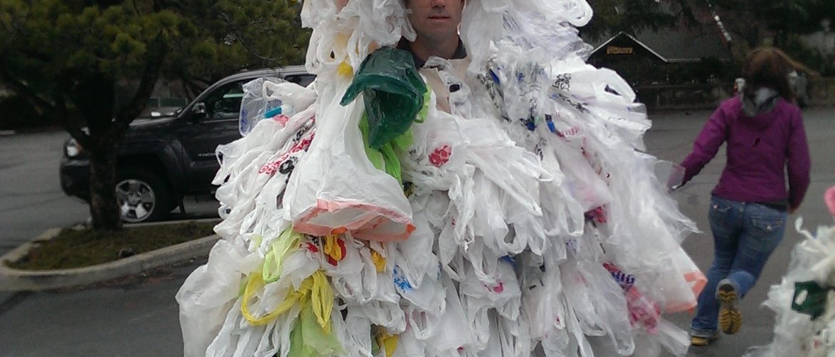 A man wearing a bag monster suit, made of 500 plastic bags